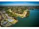 Beautiful aerial view of neighborhood with golf course on the lake, and gorgeous surrounding scenery at 1160 Lake Shore Overlook, Alpharetta, GA 30005