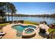 Aerial view of backyard featuring a kidney-shaped pool, spa, and lake access at 1160 Lake Shore Overlook, Alpharetta, GA 30005