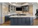 Stylish bar area with granite countertops, custom cabinetry, and brick backsplash for entertaining at 1160 Lake Shore Overlook, Alpharetta, GA 30005