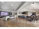 Entertainment basement showcasing a large media area, custom bar, and sleek flooring for modern comfort at 1160 Lake Shore Overlook, Alpharetta, GA 30005