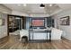 Relax in this basement featuring a home theater, luxury seating, and custom wine storage at 1160 Lake Shore Overlook, Alpharetta, GA 30005