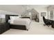 Comfortable bedroom with vaulted ceiling and a cozy seating area at 1160 Lake Shore Overlook, Alpharetta, GA 30005