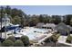 Community pool and recreation area with slides, pool houses, and sunbathing deck at 1160 Lake Shore Overlook, Alpharetta, GA 30005