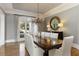 Formal dining room with chandelier, hardwood floors, and large window at 1160 Lake Shore Overlook, Alpharetta, GA 30005