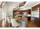 Gourmet kitchen with a large island, stainless steel appliances, hardwood floors, and light eat-in dining area at 1160 Lake Shore Overlook, Alpharetta, GA 30005