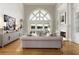 Spacious living room with fireplace, hardwood floors, and lake view at 1160 Lake Shore Overlook, Alpharetta, GA 30005