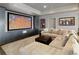 This basement features a spacious lounge area with cozy seating and a large media screen at 1160 Lake Shore Overlook, Alpharetta, GA 30005