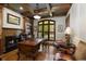 A cozy office features wood paneling, a fireplace, and a large desk, perfect for a productive workspace at 1160 Lake Shore Overlook, Alpharetta, GA 30005