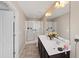 Bathroom with dual sinks, a large mirror, neutral paint, and glass shower doors at 5076 Longview Walk, Decatur, GA 30035