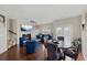 Open-concept living and dining room with hardwood floors, fireplace, and stylish furniture at 5076 Longview Walk, Decatur, GA 30035