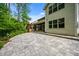 Backyard patio with pergola, screened porch, and lush greenery at 531 Rokeby Dr, Woodstock, GA 30188