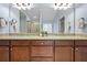 Bathroom with dual sinks, granite countertops, and large mirror at 531 Rokeby Dr, Woodstock, GA 30188