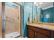 Stylish bathroom featuring granite countertop, walk-in shower, and attractive blue walls at 531 Rokeby Dr, Woodstock, GA 30188