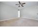 Spacious bedroom with ceiling fan and ample room for relaxation or recreation at 531 Rokeby Dr, Woodstock, GA 30188