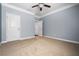Bedroom with ceiling fan, neutral paint colors and carpet at 531 Rokeby Dr, Woodstock, GA 30188