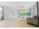 Comfortable bedroom with large window, natural light, sofa and carpet at 531 Rokeby Dr, Woodstock, GA 30188