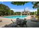 Relax by the pristine community pool, complete with comfortable seating and lounging areas at 531 Rokeby Dr, Woodstock, GA 30188