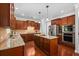 Kitchen with hardwood floors, granite countertops, tile backsplash and stainless steel appliances at 531 Rokeby Dr, Woodstock, GA 30188