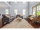 Spacious living room with hardwood floors, large windows, and comfortable seating at 531 Rokeby Dr, Woodstock, GA 30188
