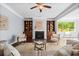 Inviting living room with a fireplace, built-in shelving, and comfortable seating at 531 Rokeby Dr, Woodstock, GA 30188