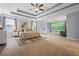 Spacious main bedroom with trey ceiling, ceiling fans, carpet and large windows at 531 Rokeby Dr, Woodstock, GA 30188