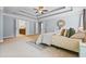 Bright main bedroom with ensuite bathroom, trey ceiling, and carpet at 531 Rokeby Dr, Woodstock, GA 30188