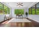 Sunroom with hardwood floors, ceiling fan, large windows and natural light at 531 Rokeby Dr, Woodstock, GA 30188