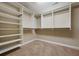 Spacious walk-in closet features custom shelving and ample hanging space for organization at 531 Rokeby Dr, Woodstock, GA 30188