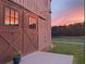 Exterior barn view with large sliding doors and adjacent concrete patio under beautiful sky at 96 Landers Ne Rd, Rydal, GA 30171