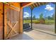 Barn with a large wooden door, offering access to a scenic outdoor area for leisure and recreation at 96 Landers Ne Rd, Rydal, GA 30171