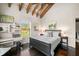 Charming bedroom featuring vaulted ceilings, wooden beams, a desk and ample natural light at 96 Landers Ne Rd, Rydal, GA 30171
