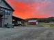 Gravel drive on a large lot with a shed and covered area for parking and storage at 96 Landers Ne Rd, Rydal, GA 30171