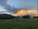 Picturesque property with a charming farmhouse, fenced pasture, and scenic views at 96 Landers Ne Rd, Rydal, GA 30171