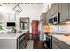 Modern kitchen featuring stainless steel appliances, granite countertops, and hardwood floors at 96 Landers Ne Rd, Rydal, GA 30171