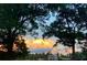 Scenic landscape with an ethereal sky, showcasing a beautiful sunset behind silhouetted trees at 96 Landers Ne Rd, Rydal, GA 30171
