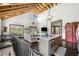 Open concept living space featuring hardwood floors, vaulted wood beam ceilings and granite kitchen island at 96 Landers Ne Rd, Rydal, GA 30171