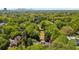 Lush green neighborhood with mature trees, manicured lawns and winding roads, showcasing the Atlanta skyline at 289 W Paces Ferry Nw Rd, Atlanta, GA 30305