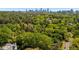 Overhead view of a wooded property near the city with a charming residence nestled among mature trees at 289 W Paces Ferry Nw Rd, Atlanta, GA 30305