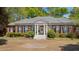 Beautiful brick house with grand columns, tidy landscaping, and circular driveway for a welcoming curb appeal at 289 W Paces Ferry Nw Rd, Atlanta, GA 30305
