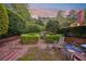 Tranquil garden featuring manicured hedges, comfortable seating, and a peaceful ambiance at 289 W Paces Ferry Nw Rd, Atlanta, GA 30305
