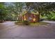 Charming brick outbuilding with lush landscaping and convenient circular driveway access at 289 W Paces Ferry Nw Rd, Atlanta, GA 30305