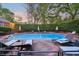 Inviting pool with lounge chairs and umbrella-shaded tables, perfect for outdoor relaxation and entertaining at 289 W Paces Ferry Nw Rd, Atlanta, GA 30305