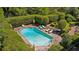 Inviting pool area surrounded by lush greenery, lounge chairs, and an umbrella-shaded table, perfect for relaxation at 289 W Paces Ferry Nw Rd, Atlanta, GA 30305