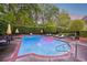 Inviting in-ground pool with lounge chairs and umbrella-shaded tables, perfect for outdoor relaxation and entertaining at 289 W Paces Ferry Nw Rd, Atlanta, GA 30305