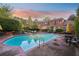 Beautiful pool with lounge chairs and umbrella-shaded tables, situated behind this gorgeous brick home at 289 W Paces Ferry Nw Rd, Atlanta, GA 30305