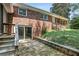 Brick home with sliding glass doors to backyard and steps to second story entry at 3007 Octavia Cir, Marietta, GA 30062