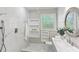 Modern bathroom with marble tile, updated fixtures, and stylish vanity at 3007 Octavia Cir, Marietta, GA 30062