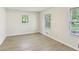 Inviting bedroom features stylish vinyl plank floors and bright natural light at 3007 Octavia Cir, Marietta, GA 30062