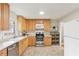 Bright kitchen with light wood cabinets, stainless steel appliances, and a built-in microwave at 3007 Octavia Cir, Marietta, GA 30062