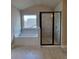 Bathtub and glass shower in bathroom with tile surround at 3325 Linstead Ct, Loganville, GA 30052